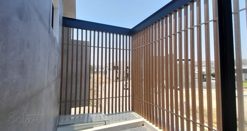 Vigas para exterior en fachada residencial Solart